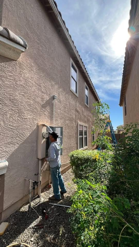Outdoor service panel work on residential exterior