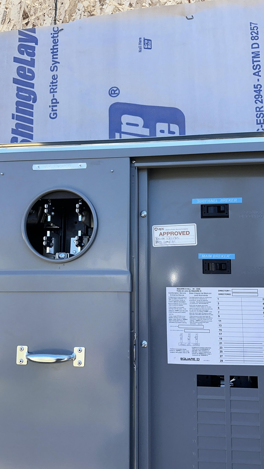 Open meter main panel with breakers and conduit risers