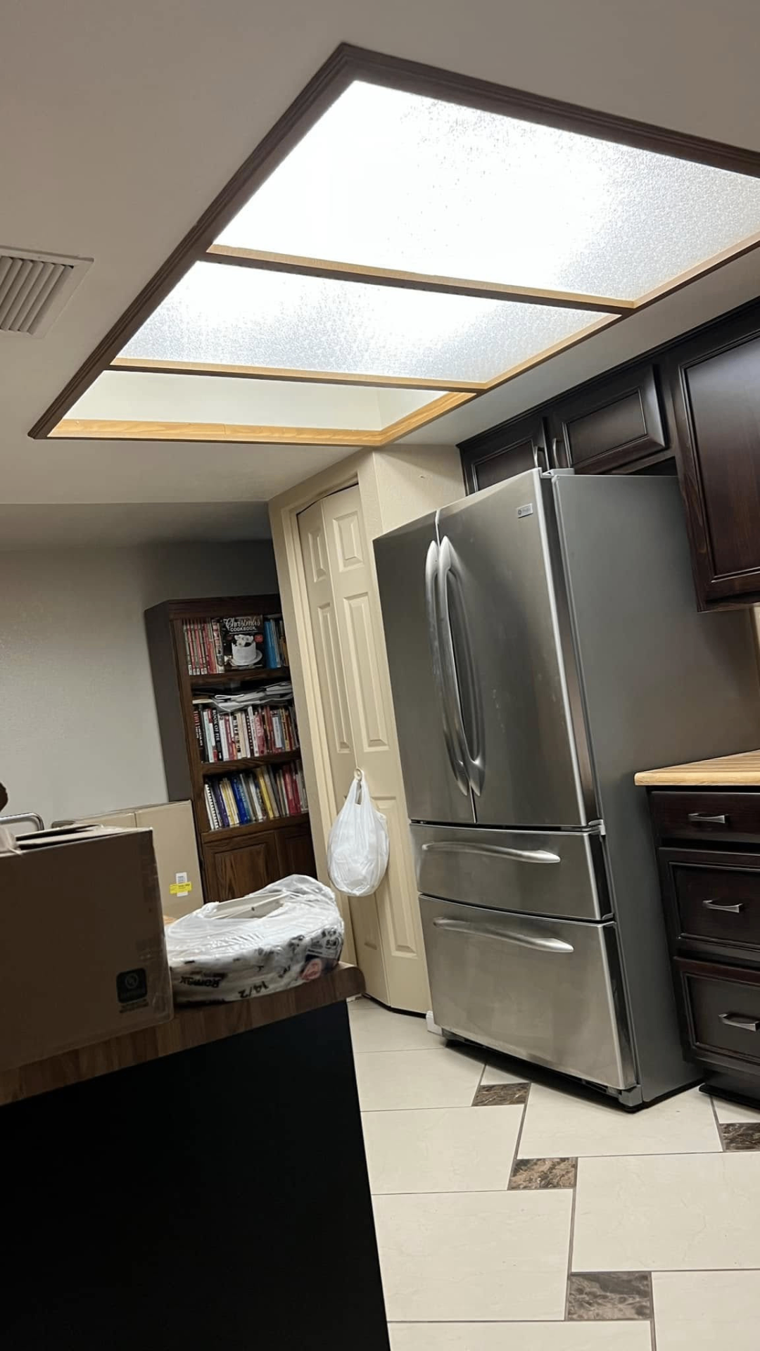 Original kitchen — outdated fluorescent ceiling box before retrofit